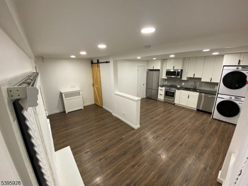 Interior, Kitchen, Recessed Lighting, Stainless Steel Appliances, Washer, Wood Texture Flooring