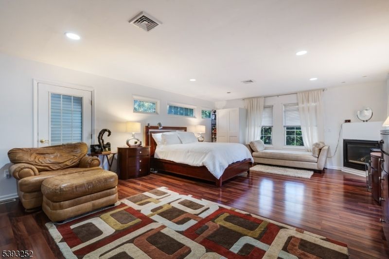 Bedroom, Fireplace, Interior, Recessed Lighting, Wood Texture Flooring