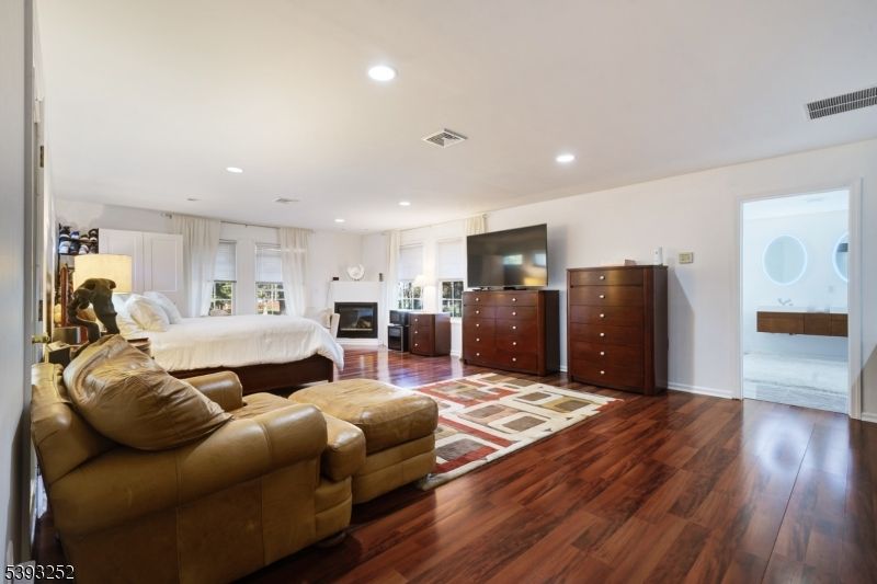 Bedroom, Fireplace, Interior, Recessed Lighting, Wood Texture Flooring