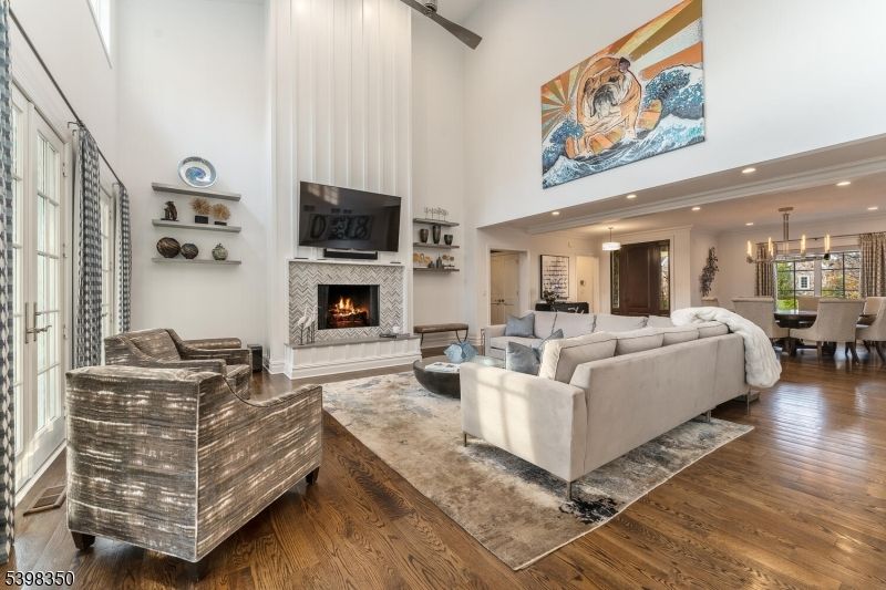 Chandelier, Dining room, Fireplace, Interior, Living room, Pendant Lights, Recessed Lighting, Wood Texture Flooring