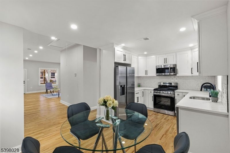 Dining room, Interior, Kitchen, Recessed Lighting, Stainless Steel Appliances, Wood Texture Flooring