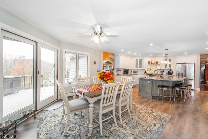 Dining room, Interior, Kitchen, Pendant Lights, Recessed Lighting, Stainless Steel Appliances, Wood Texture Flooring