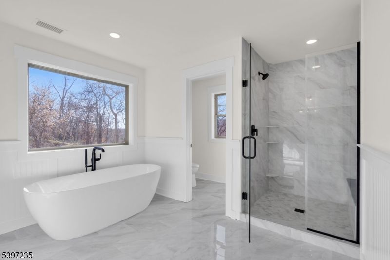 Bathroom, Free Standing Baths, Glass Shower, Interior, Marble, Marble Walls, Recessed Lighting