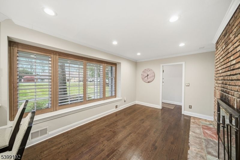 Empty room, Fireplace, Interior, Recessed Lighting, Stone Walls, Wood Texture Flooring