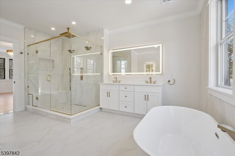 Bathroom, Dual Sink Vanities, Free Standing Baths, Glass Shower, Interior, Marble, Marble Walls, Recessed Lighting