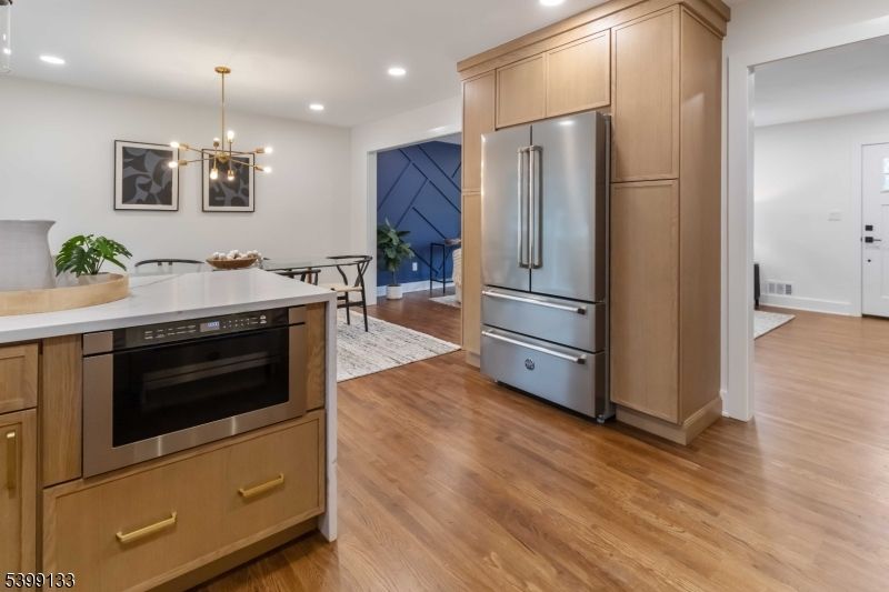 Dining room, Interior, Kitchen, Pendant Lights, Recessed Lighting, Stainless Steel Appliances, Wood Texture Flooring