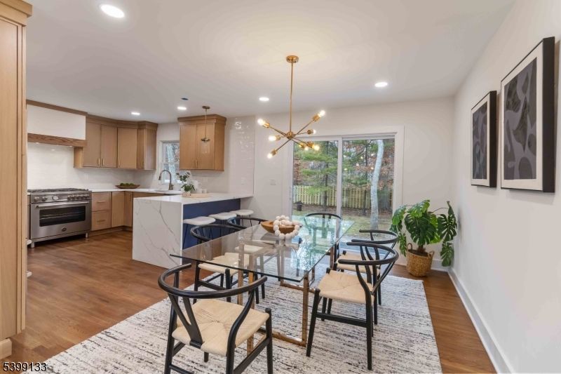 Dining room, Interior, Kitchen, Pendant Lights, Recessed Lighting, Stainless Steel Appliances, Wood Texture Flooring