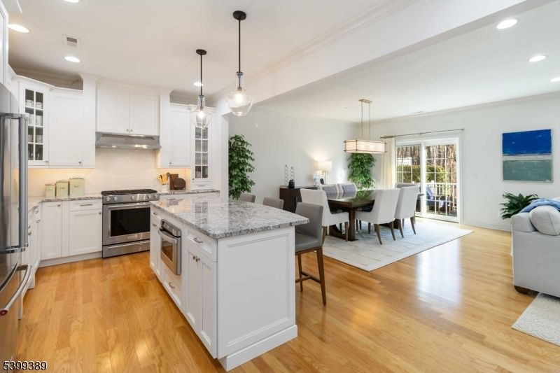 Dining room, Interior, Kitchen, Pendant Lights, Recessed Lighting, Stainless Steel Appliances, Wood Texture Flooring