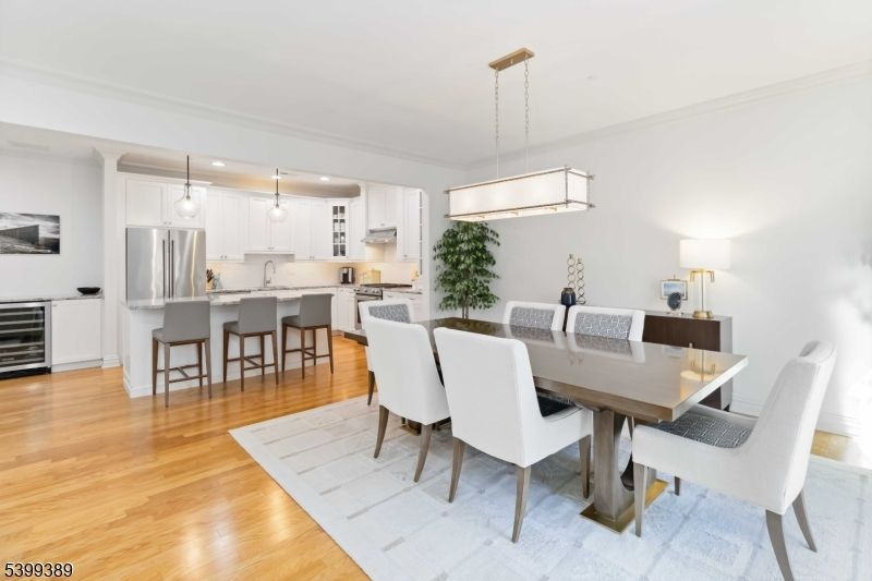 Chandelier, Dining room, Interior, Kitchen, Pendant Lights, Recessed Lighting, Stainless Steel Appliances, Wood Texture Flooring