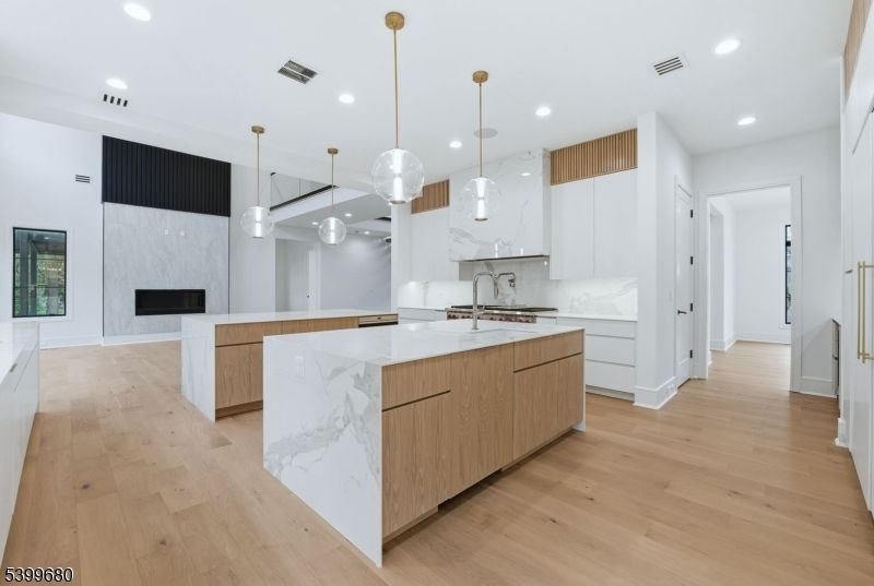 Fireplace, Interior, Kitchen, Marble Walls, Pendant Lights, Recessed Lighting, Wood Texture Flooring