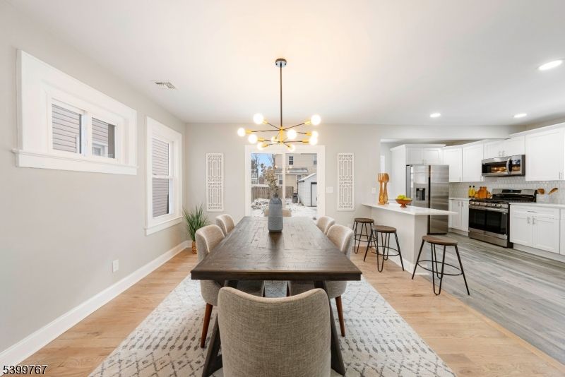Dining room, Interior, Kitchen, Pendant Lights, Recessed Lighting, Stainless Steel Appliances, Wood Texture Flooring