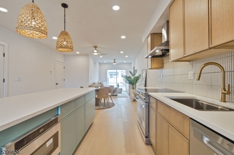 Dining room, Interior, Kitchen, Living room, Pendant Lights, Recessed Lighting, Stainless Steel Appliances, Wood Texture Flooring