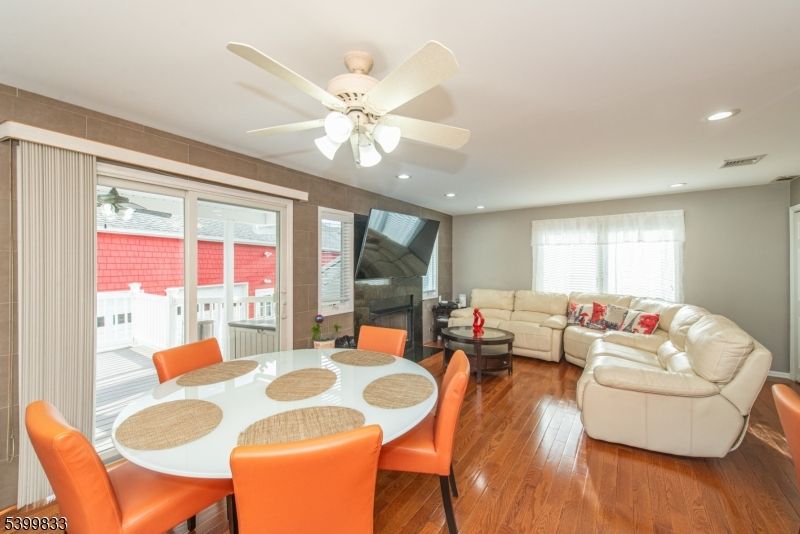 Dining room, Fireplace, Interior, Living room, Recessed Lighting, Wood Texture Flooring
