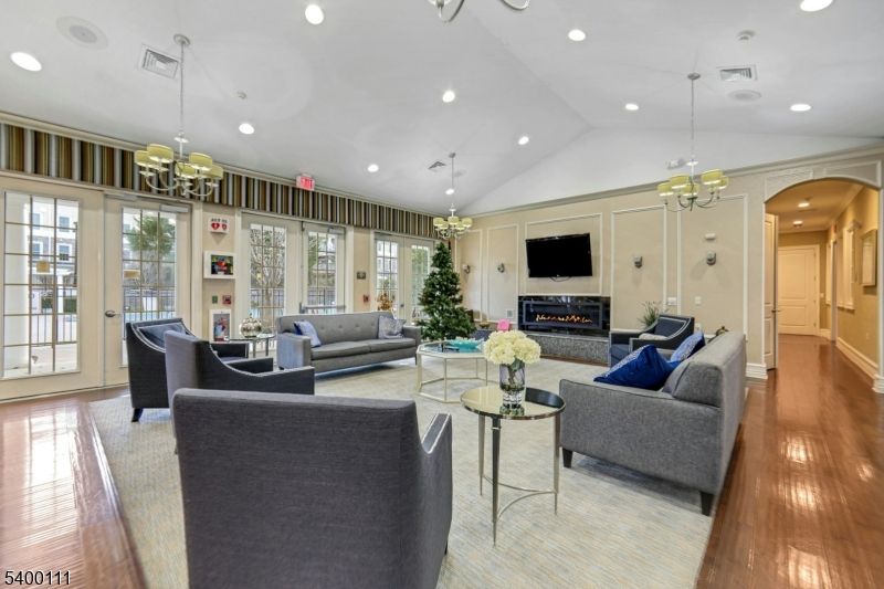 Chandelier, Fireplace, Interior, Living room, Pendant Lights, Recessed Lighting, Wood Texture Flooring