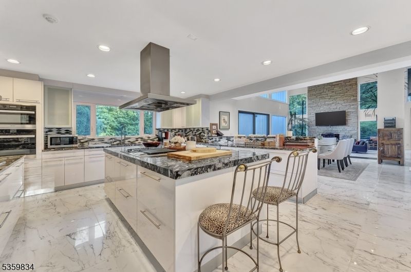 Dining room, Fireplace, Interior, Kitchen, Living room, Marble, Recessed Lighting, Stainless Steel Appliances, Stone Walls