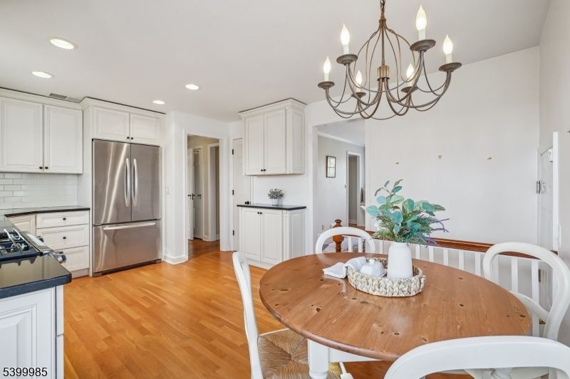 Chandelier, Dining room, Interior, Kitchen, Recessed Lighting, Stainless Steel Appliances, Wood Texture Flooring