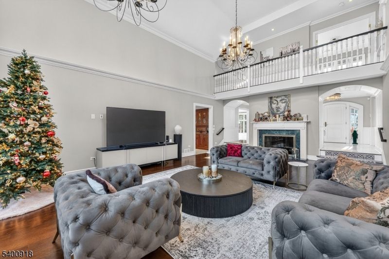 Chandelier, Fireplace, Interior, Living room, Recessed Lighting, Wood Texture Flooring