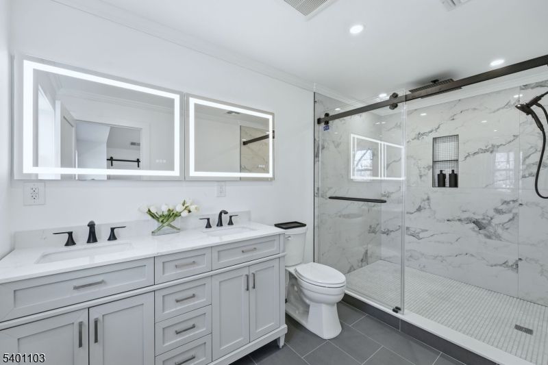 Bathroom, Dual Sink Vanities, Glass Shower, Interior, Marble Walls, Recessed Lighting