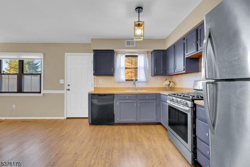 Interior, Kitchen, Pendant Lights, Stainless Steel Appliances, Wood Texture Flooring