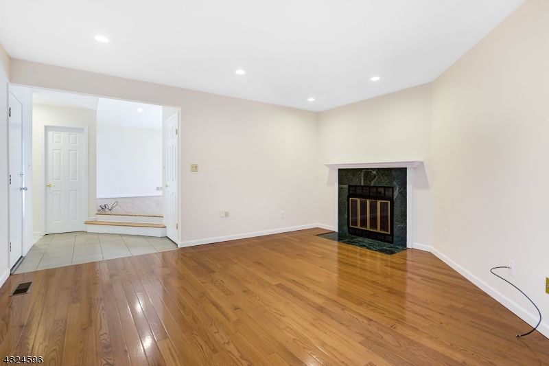 Empty room, Fireplace, Interior, Recessed Lighting, Wood Texture Flooring