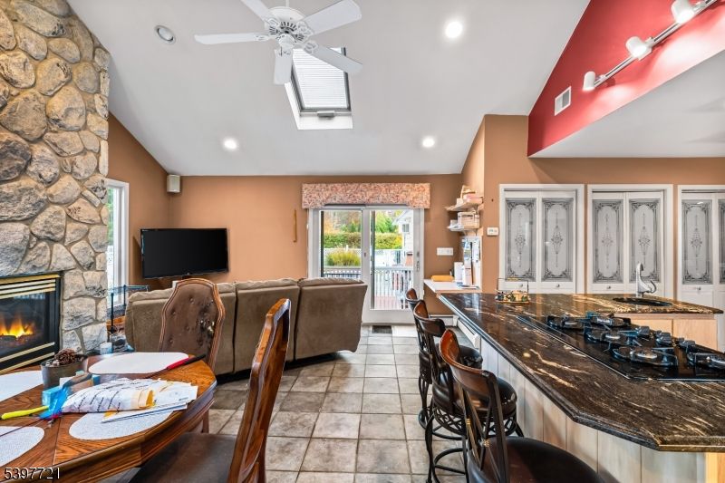 Dining room, Fireplace, Interior, Kitchen, Living room, Recessed Lighting, Stone Walls