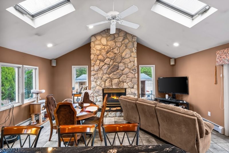 Dining room, Fireplace, Interior, Living room, Recessed Lighting, Stone Walls