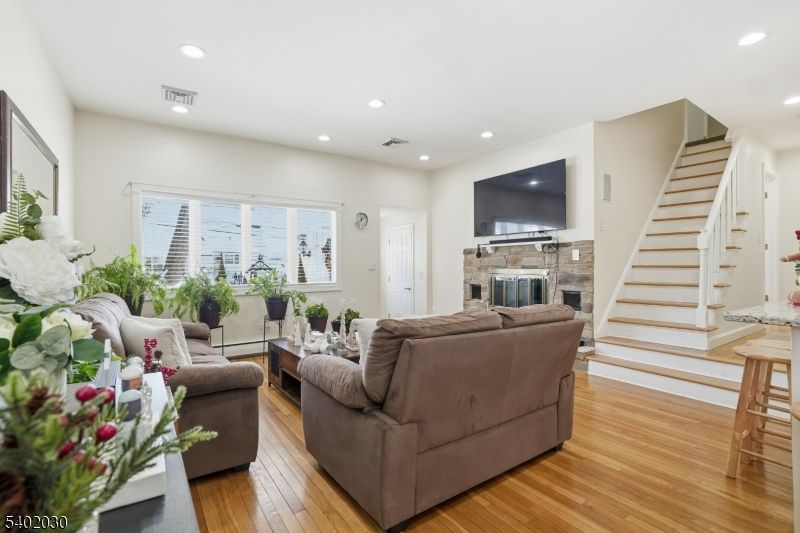 Fireplace, Interior, Living room, Recessed Lighting, Wood Texture Flooring