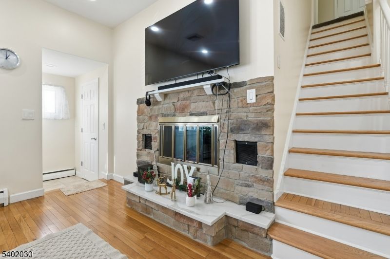 Fireplace, Interior, Recessed Lighting, Stone Walls, Wood Texture Flooring