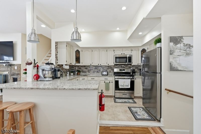 Interior, Kitchen, Pendant Lights, Recessed Lighting, Stainless Steel Appliances, Wood Texture Flooring
