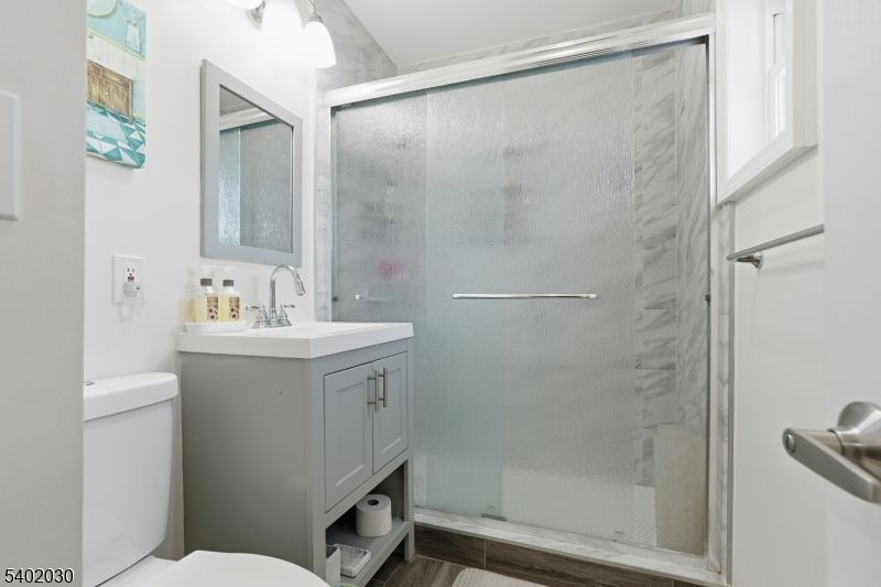 Bathroom, Glass Shower, Interior, Marble Walls, Wood Texture Flooring