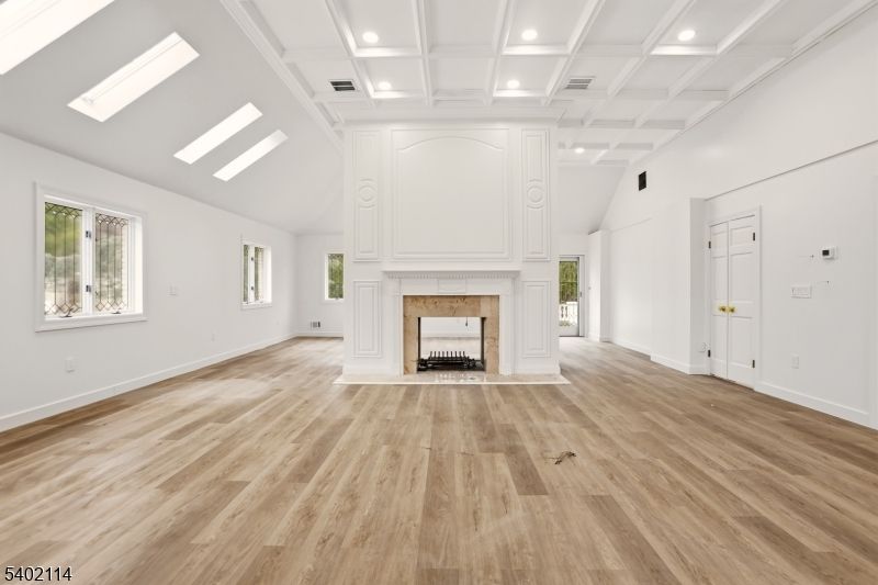 Empty room, Fireplace, Interior, Recessed Lighting, Wood Texture Flooring