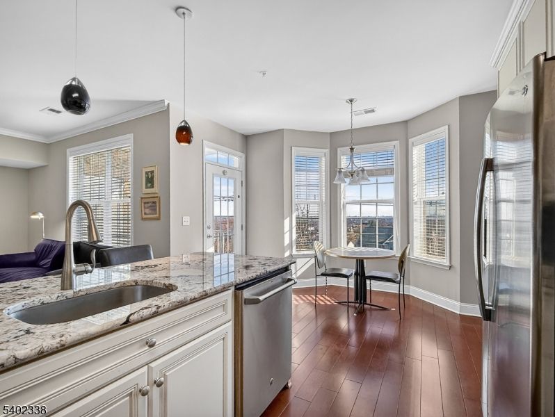 Dining room, Interior, Kitchen, Pendant Lights, Stainless Steel Appliances, Wood Texture Flooring