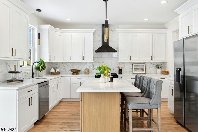 Interior, Kitchen, Marble Walls, Pendant Lights, Recessed Lighting, Stainless Steel Appliances, Wood Texture Flooring