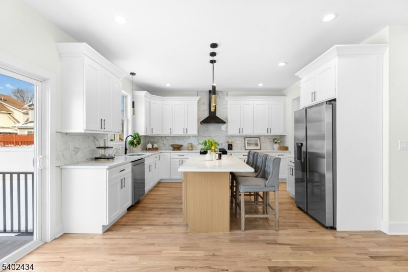Interior, Kitchen, Marble Walls, Pendant Lights, Recessed Lighting, Stainless Steel Appliances, Wood Texture Flooring
