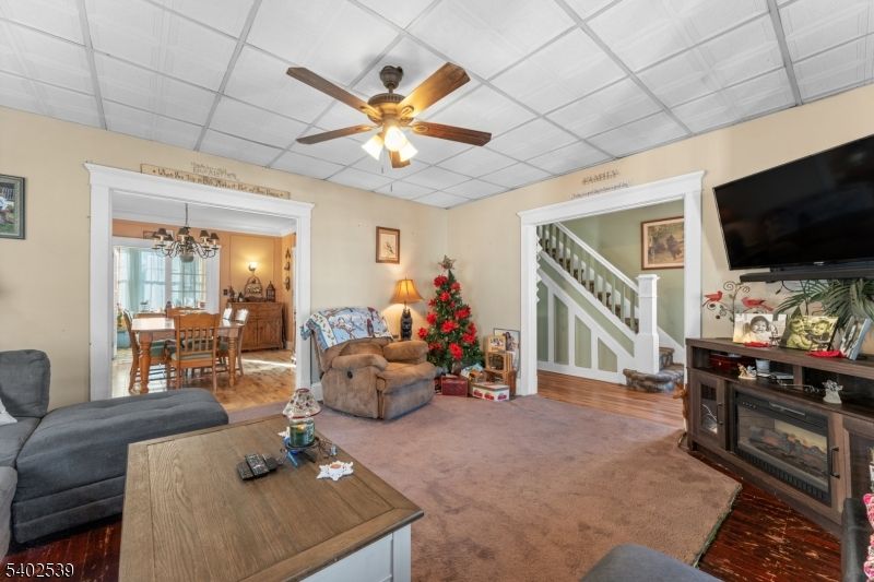 Chandelier, Dining room, Fireplace, Interior, Living room, Wood Texture Flooring