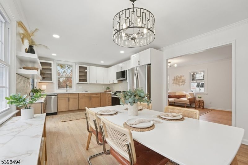 Chandelier, Dining room, Interior, Kitchen, Recessed Lighting, Stainless Steel Appliances, Wood Texture Flooring