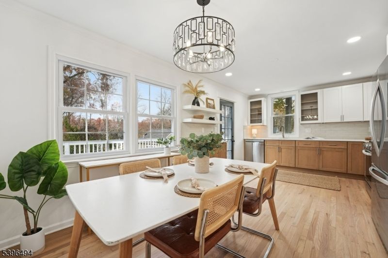 Chandelier, Dining room, Interior, Kitchen, Recessed Lighting, Stainless Steel Appliances, Wood Texture Flooring