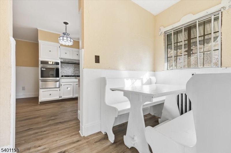 Dining room, Interior, Kitchen, Pendant Lights, Stainless Steel Appliances, Wood Texture Flooring