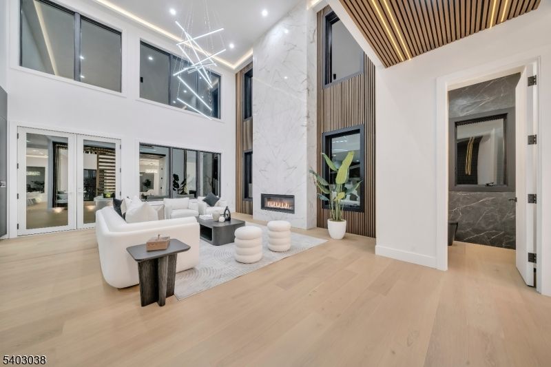 Fireplace, Interior, Living room, Marble Walls, Pendant Lights, Recessed Lighting, Wood Texture Flooring