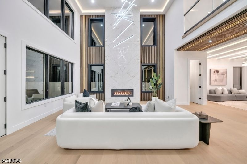 Fireplace, Interior, Living room, Marble Walls, Recessed Lighting, Wood Texture Flooring