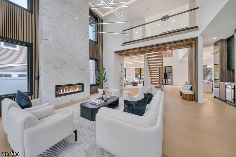 Fireplace, Interior, Living room, Marble Walls, Pendant Lights, Recessed Lighting, Wood Texture Flooring