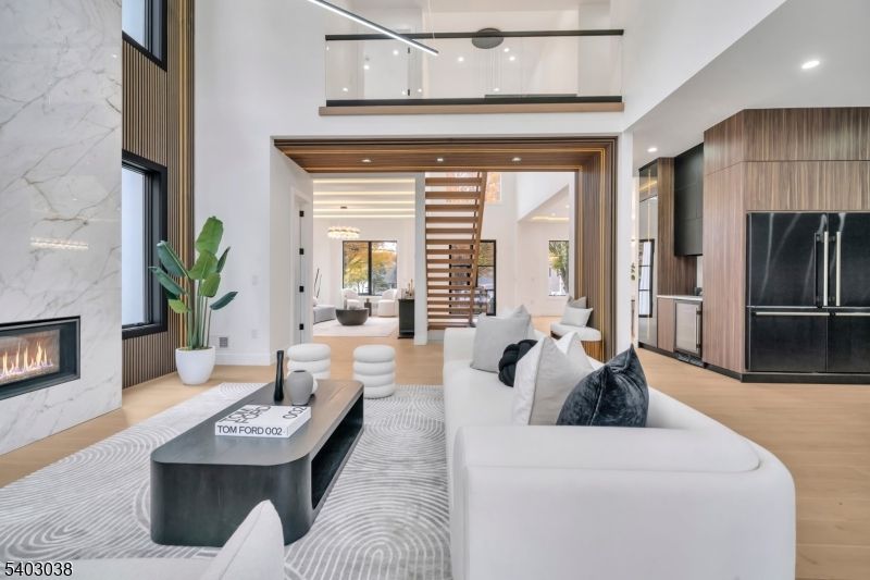 Fireplace, Interior, Living room, Marble Walls, Recessed Lighting, Wood Texture Flooring