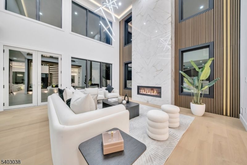 Fireplace, Interior, Living room, Marble Walls, Pendant Lights, Recessed Lighting, Wood Texture Flooring