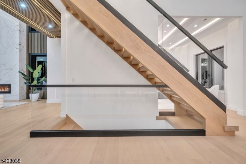 Fireplace, Interior, Marble Walls, Recessed Lighting, Wood Texture Flooring