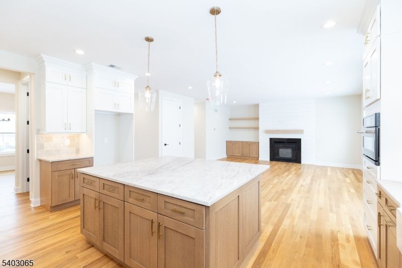 Fireplace, Interior, Kitchen, Pendant Lights, Recessed Lighting, Wood Texture Flooring