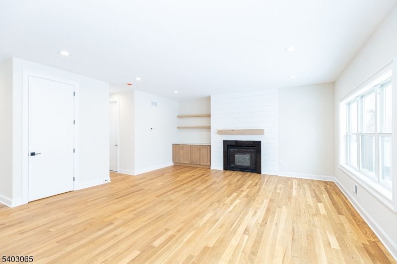 Empty room, Fireplace, Interior, Recessed Lighting, Wood Texture Flooring