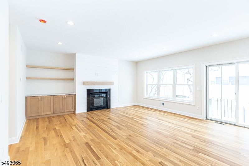 Empty room, Fireplace, Interior, Recessed Lighting, Wood Texture Flooring