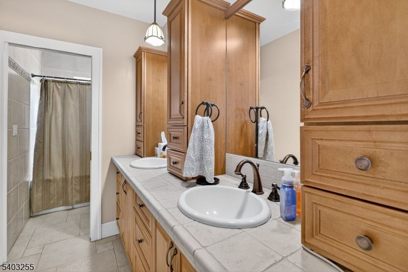 Bathroom, Dual Sink Vanities, Interior, Pendant Lights, Tile Countertops