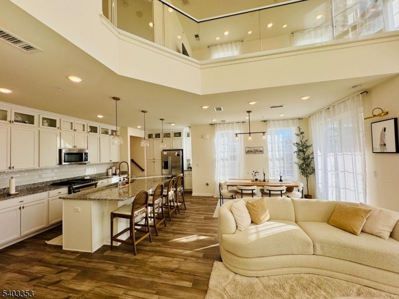 Dining room, Interior, Kitchen, Living room, Pendant Lights, Recessed Lighting, Stainless Steel Appliances, Wood Texture Flooring