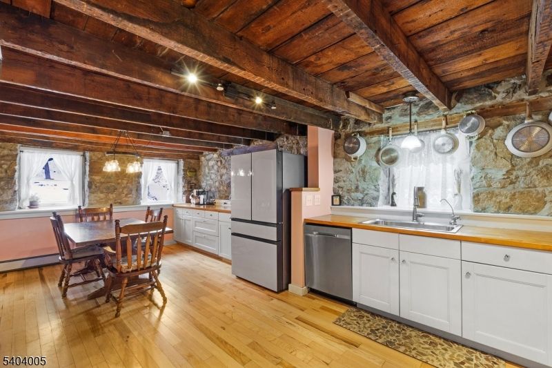 Dining room, Interior, Kitchen, Pendant Lights, Stainless Steel Appliances, Stone Walls, Wooden Beams, Wooden Ceilings, Wood Texture Flooring